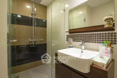 Modern bathroom with glass shower and stylish sink area