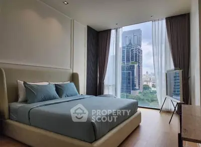 Luxurious bedroom with stunning city view and modern decor