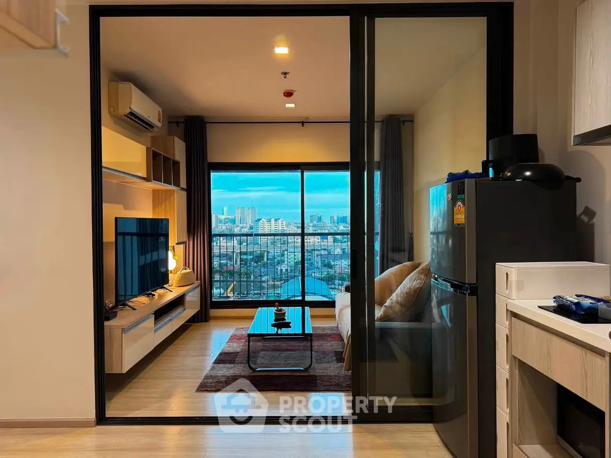 Modern living room with city view, sleek furniture, and open layout in high-rise apartment.