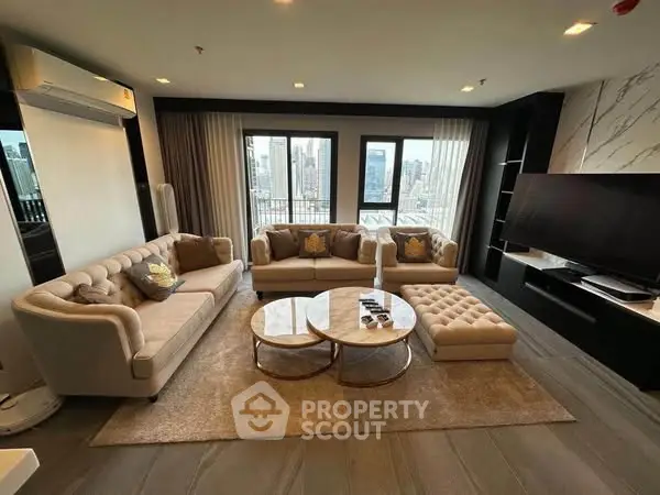 Luxurious living room with plush sofas and city view