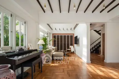 Spacious living room with elegant parquet flooring and natural light