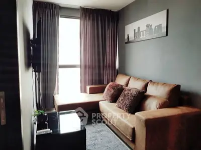 Cozy living room with modern decor and plush brown sofa