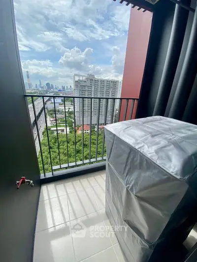 High-rise balcony with stunning cityscape view and covered appliance, perfect for urban living.
