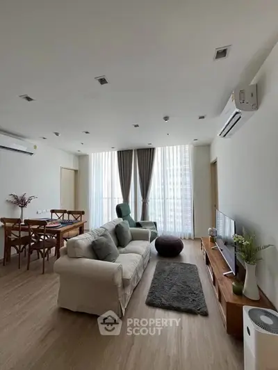 Spacious modern living room with elegant decor and natural light