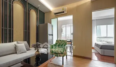 Stylish open-plan living room with modern decor and natural light