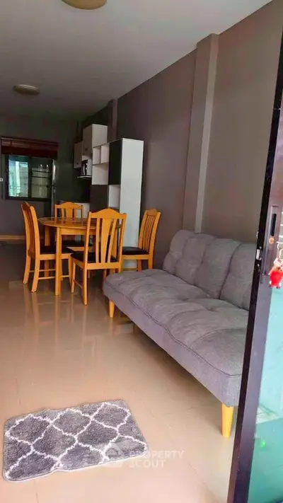 Spacious living room with modern furniture and dining area