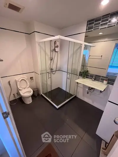 Modern bathroom with glass shower and sleek fixtures