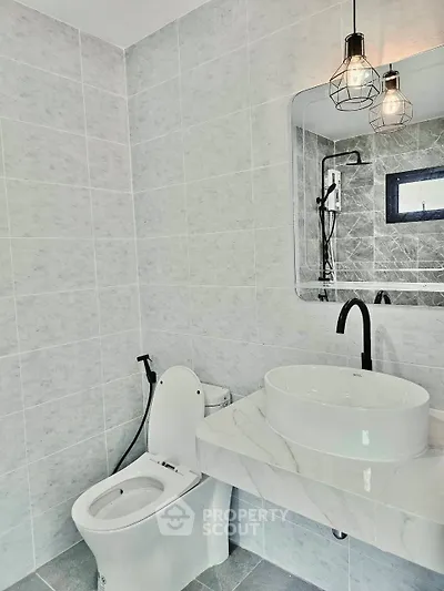 Modern bathroom with sleek fixtures and elegant tile design