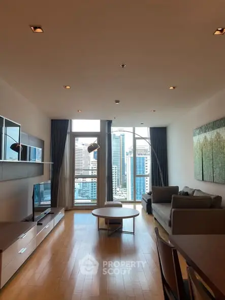 Spacious modern living room with city view and elegant furnishings