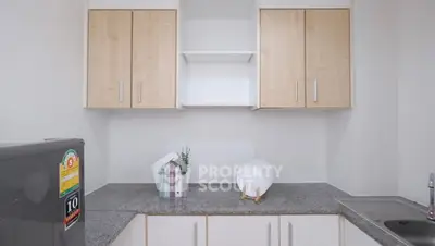 Modern kitchen with sleek cabinets and granite countertops