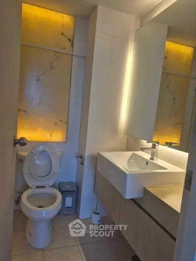 Modern bathroom with elegant lighting and sleek fixtures