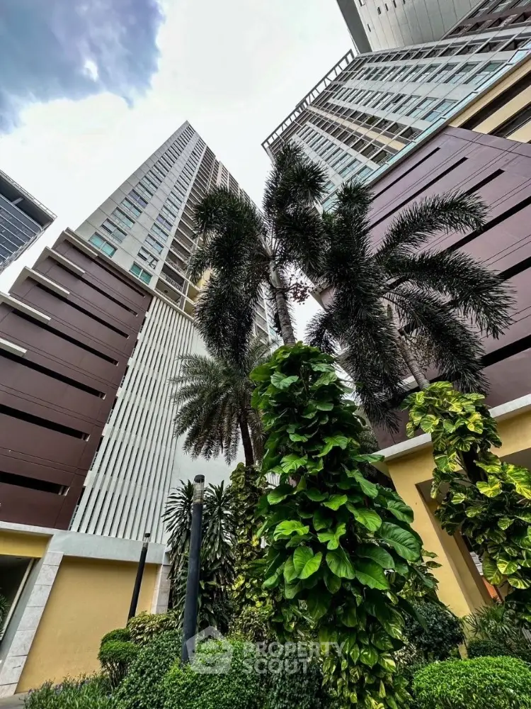 Stunning high-rise building with lush greenery and modern architecture.