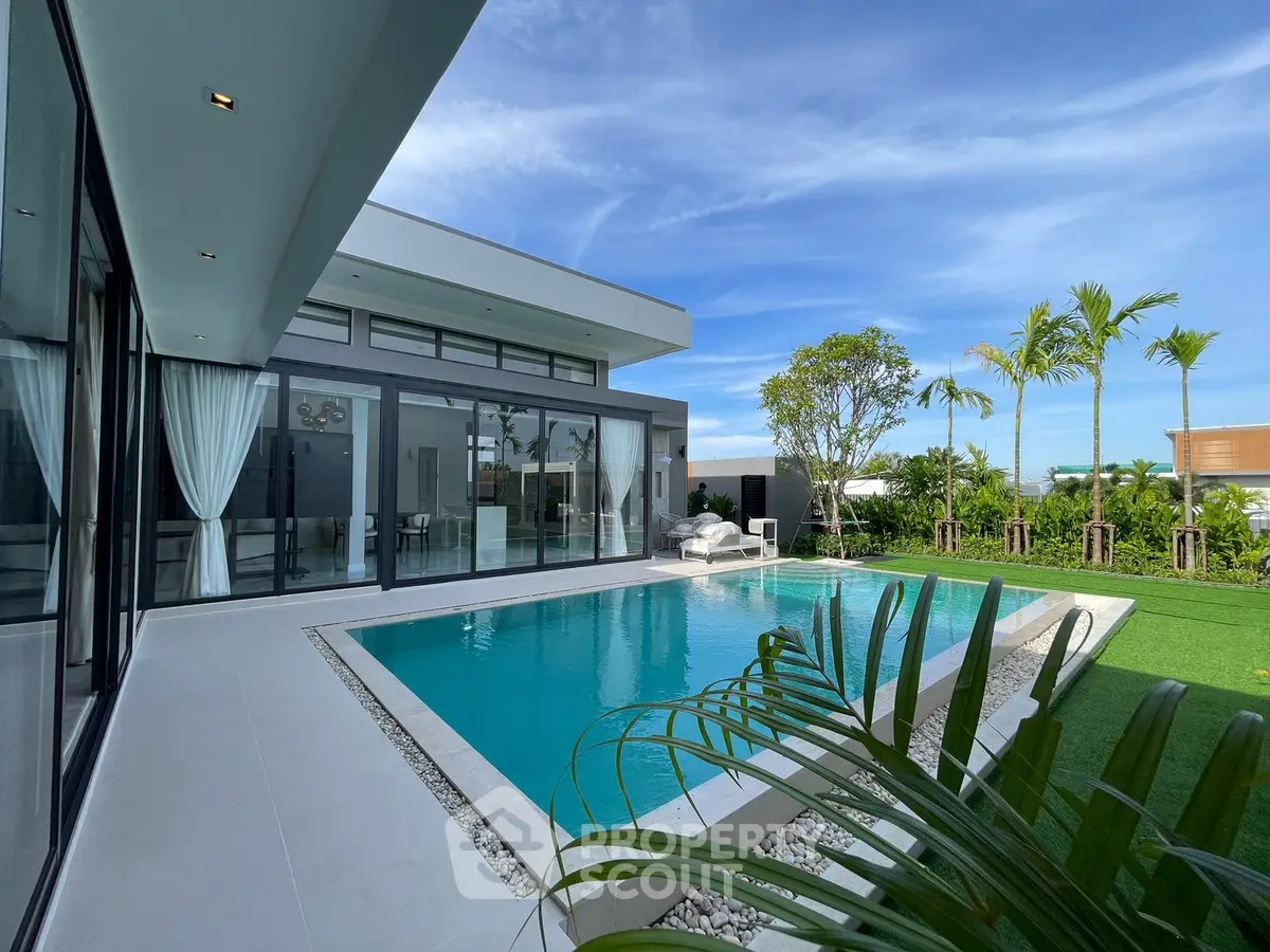 Luxurious modern villa with private pool and lush garden, perfect for relaxation and entertainment.