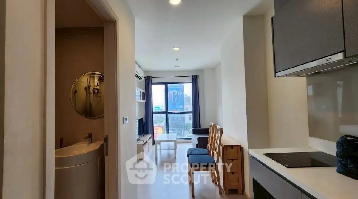 Modern apartment interior with open kitchen and city view