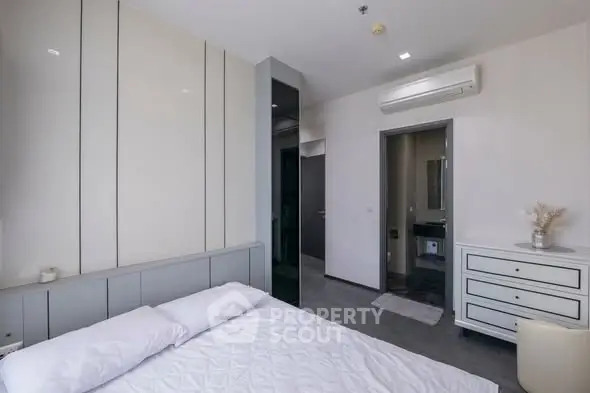 Modern bedroom with sleek design and air conditioning unit