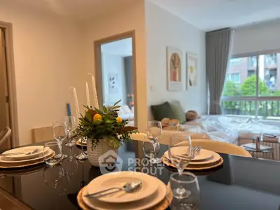 Elegant dining area with modern decor and large windows in a stylish apartment.