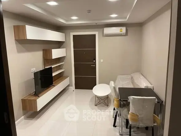 Modern living room with sleek furniture and air conditioning in a cozy apartment.