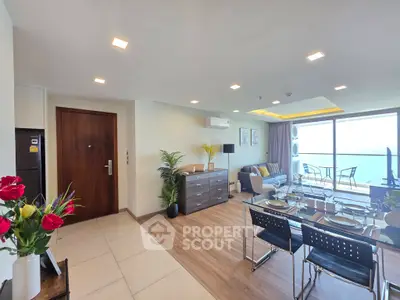 Spacious modern living room with ocean view and elegant dining area