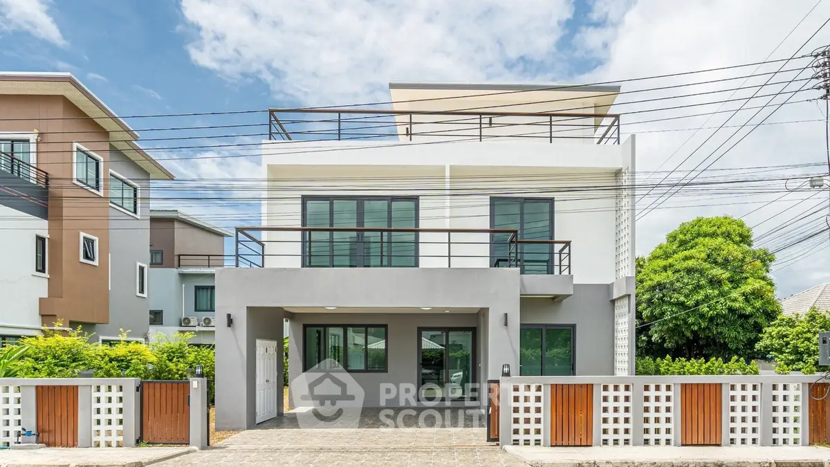 Modern two-story house with spacious balcony and sleek design