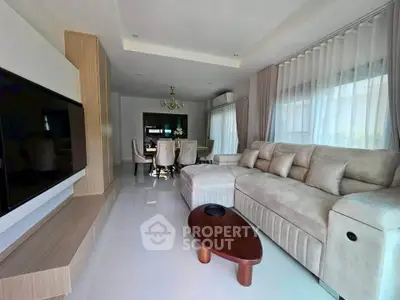 Spacious modern living room with elegant decor and large windows