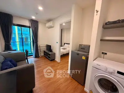 Modern apartment interior with living room, bedroom, and in-unit washer