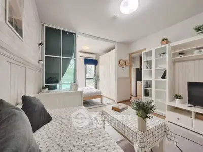 Charming living room with cozy decor and natural light in modern apartment