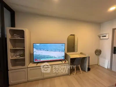 Modern living room with sleek TV stand and stylish desk setup