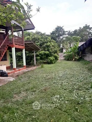 Charming rural property with lush garden and traditional architecture, perfect for serene living.