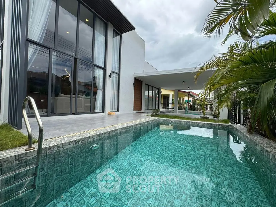 Luxurious modern home with private pool and spacious patio, perfect for relaxation and entertainment.