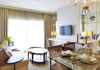 Elegant living room with modern decor, large windows, and stylish dining area.