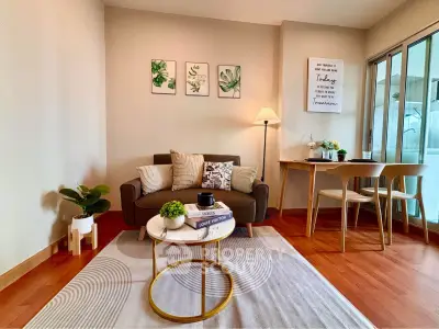 Charming living room with cozy seating and stylish decor, perfect for relaxation and entertaining.