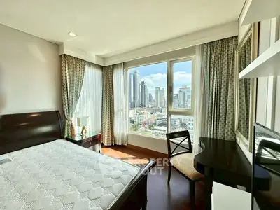 Luxurious bedroom with stunning city view, featuring elegant furniture and large windows for natural light.