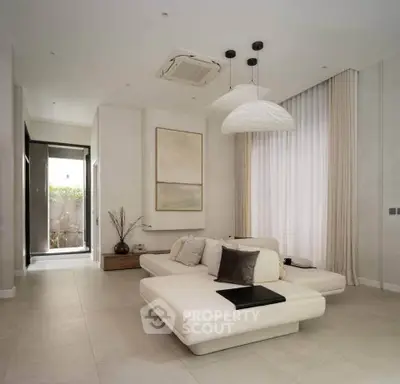 Elegant modern living room with minimalist decor and natural light