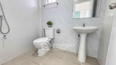 Modern bathroom with sleek fixtures and stylish tile design, perfect for a contemporary home.