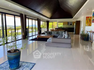 Spacious modern living room with panoramic views and elegant decor