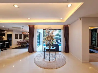 Luxurious open-plan living room with elegant decor and large windows