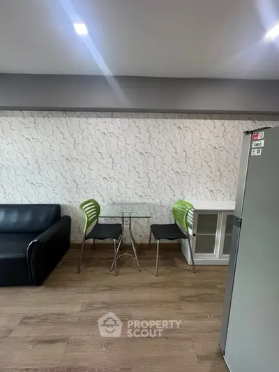 Modern living room with stylish furniture and sleek flooring, perfect for contemporary living.