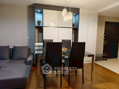 Modern living room with sleek dining area and stylish decor