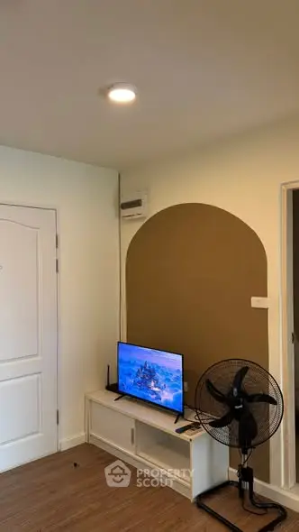 Modern living room with stylish decor and entertainment setup