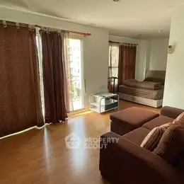 Spacious living room with cozy seating and natural light