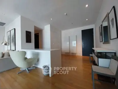 Spacious modern living room with stylish furniture and wooden flooring