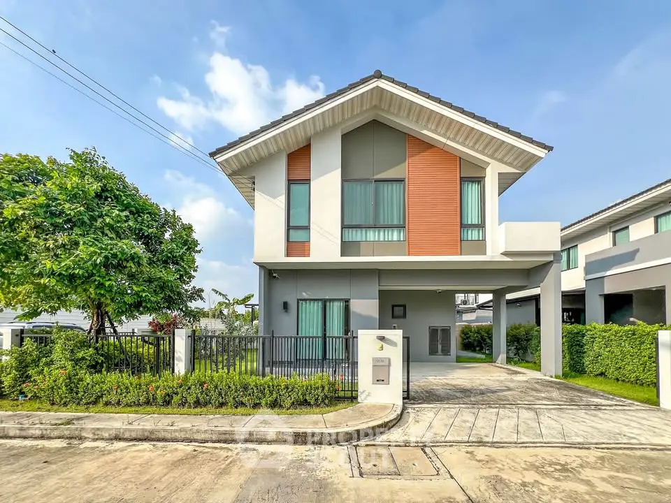 Modern two-story house with sleek design and spacious driveway