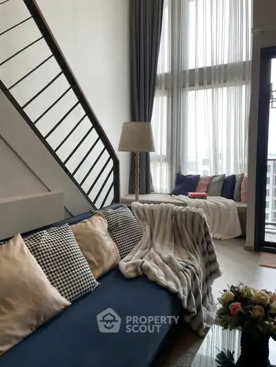 Stylish modern living room with high ceilings and cozy decor