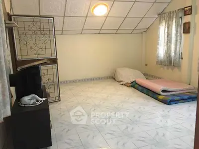 Cozy minimalist bedroom with tiled floor and natural light