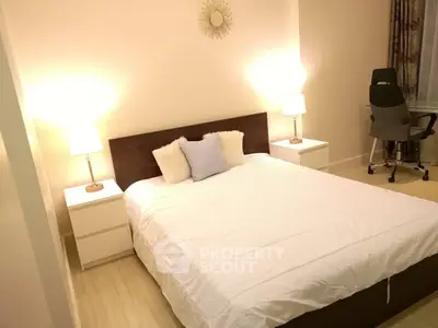 Cozy bedroom with modern decor and comfortable bed