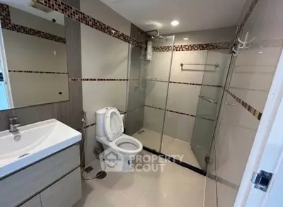 Modern bathroom with glass shower and sleek fixtures