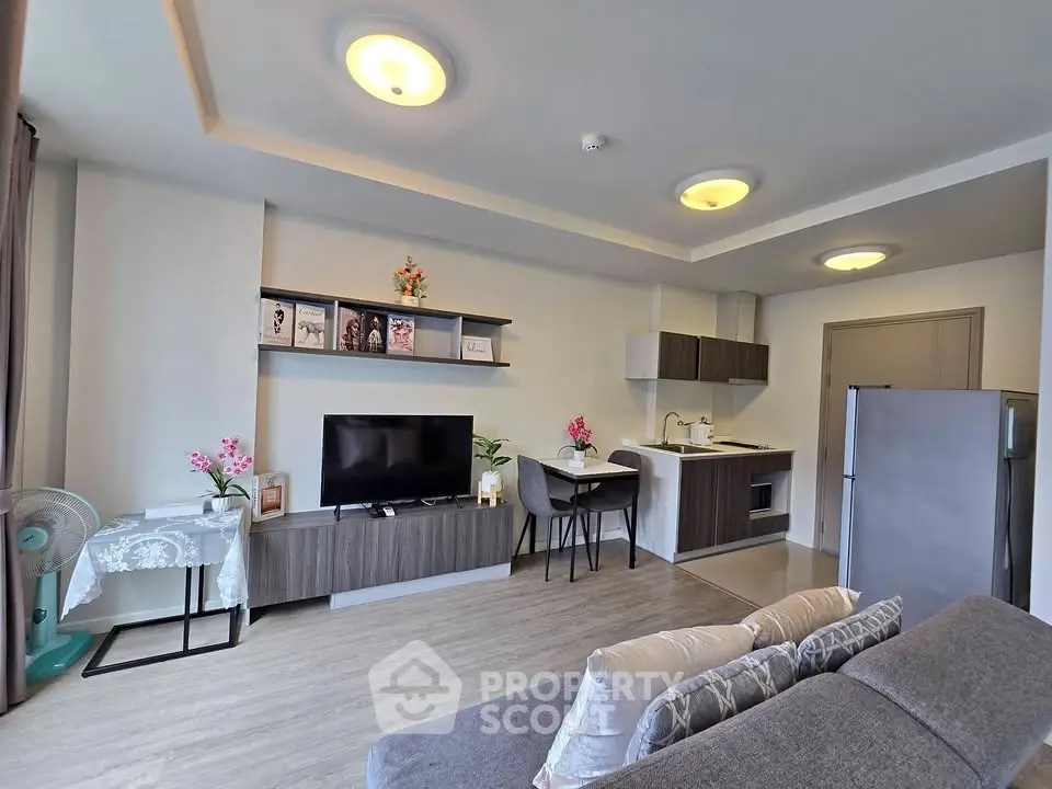 Modern living room with open kitchen and stylish decor
