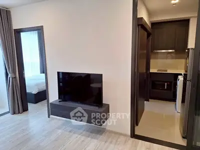 Modern apartment interior with sleek kitchen and cozy living area