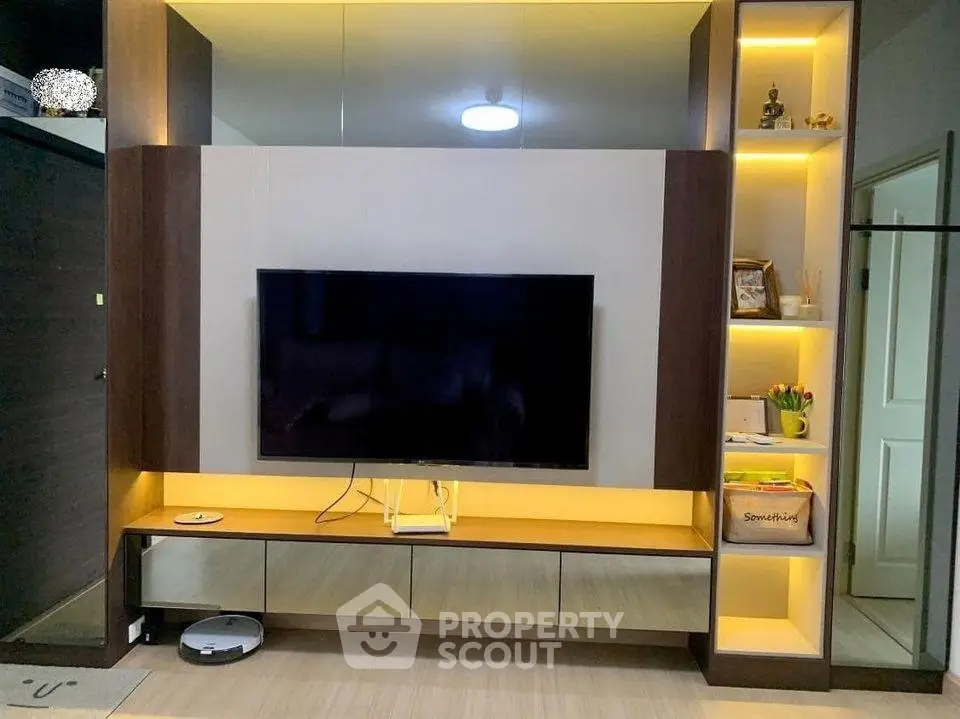 Modern living room with sleek TV unit and ambient lighting