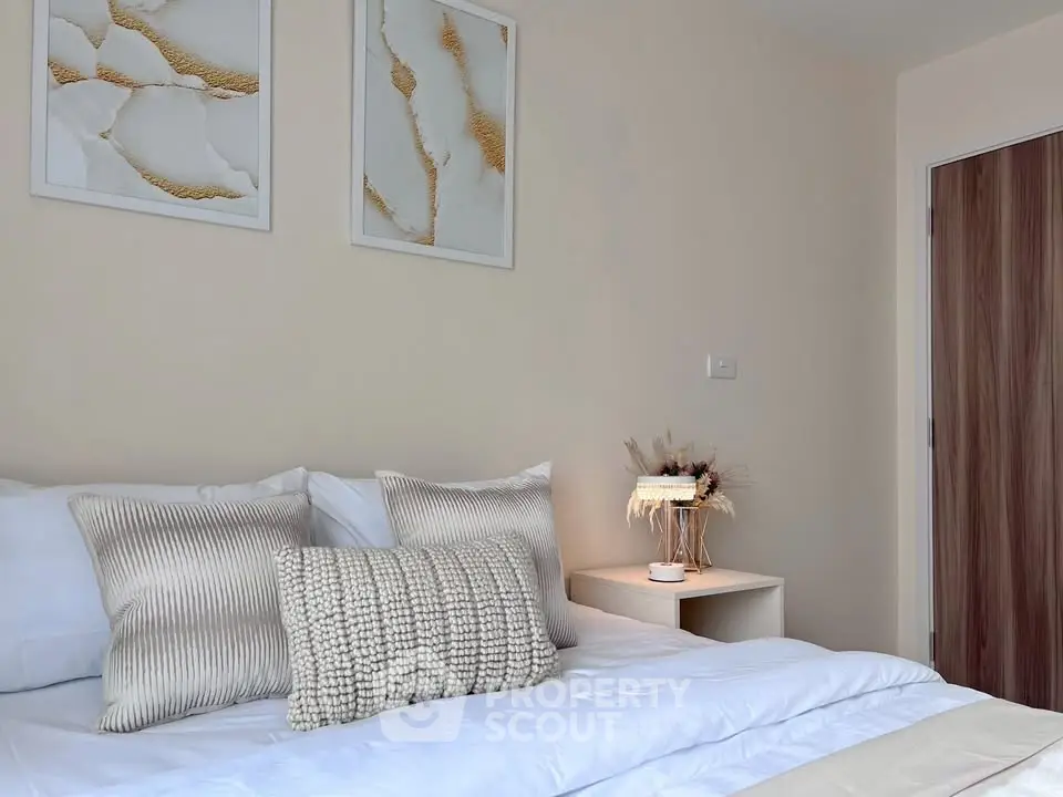 Elegant bedroom with stylish decor and cozy bedding